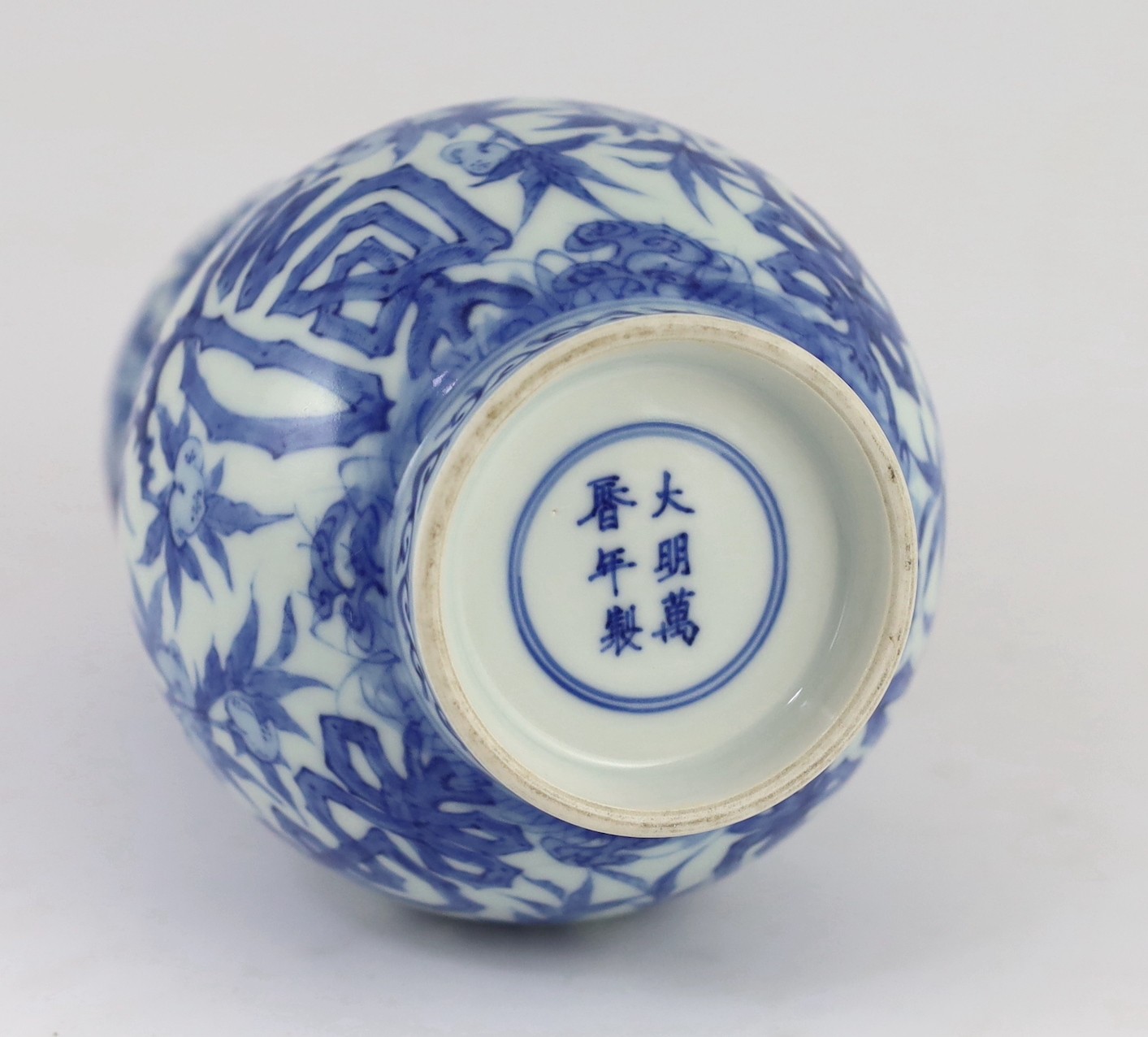 A Chinese blue and white 'fu lu shou' double gourd vase, Wanli mark probably late 19th century, 22cm high, splinter chip to rim and hairline crack to neck